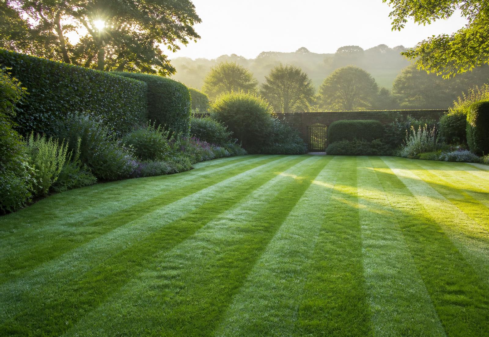 Well-kept Dorset garden with striped lawn